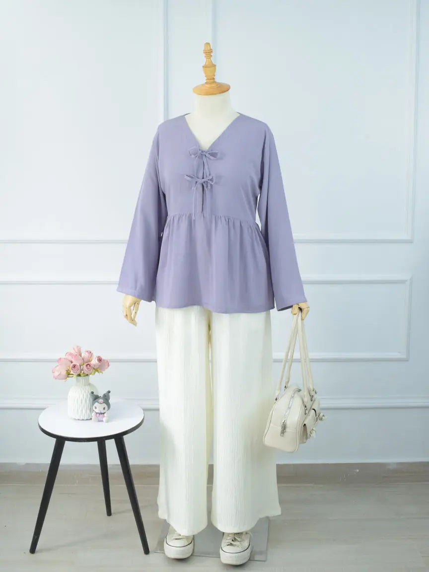 DOVE textured off-white wide-leg pants styled with a lavender top