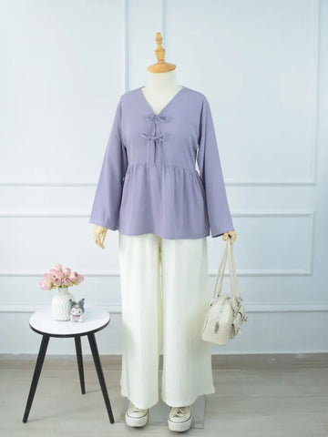 DOVE textured off-white wide-leg pants styled with a lavender top