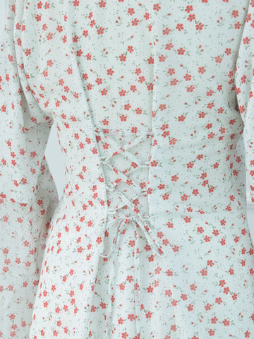 Close-up of corset lace-up back on white floral kurti