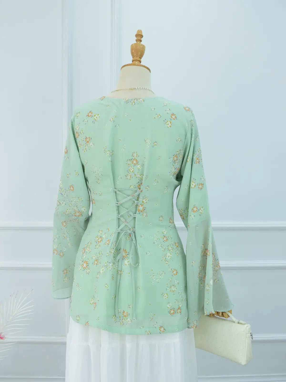 Fiora green floral kurti back view, corset lace-up detail