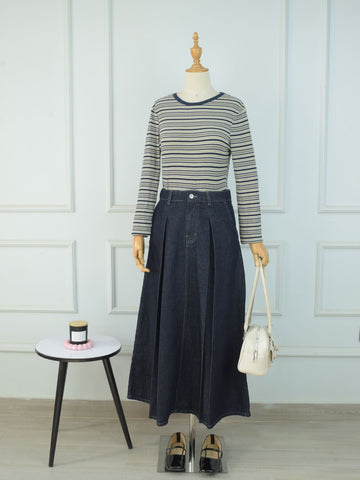 Full length front view of charcoal blue denim maxi skirt styled with striped top, white bag and black loafers on mannequin