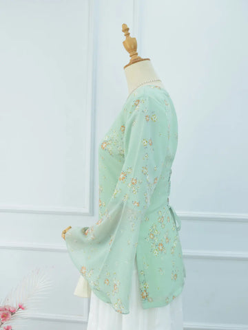 Close-up of V-neck and sheer bell sleeve, green kurti