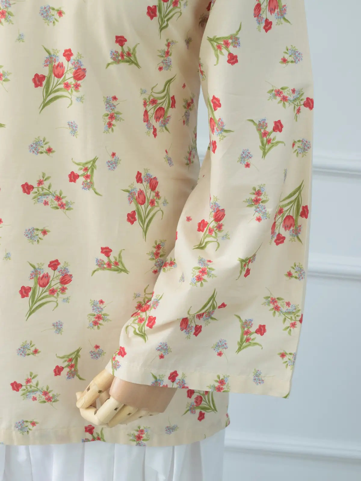 V-neckline and decorative tie close-up of Rosie Bloom beige floral lawn kurti – elegant neckline detailing
