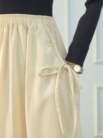 DAZY - BEIGE FLARED SKIRT WITH BOW POCKETS