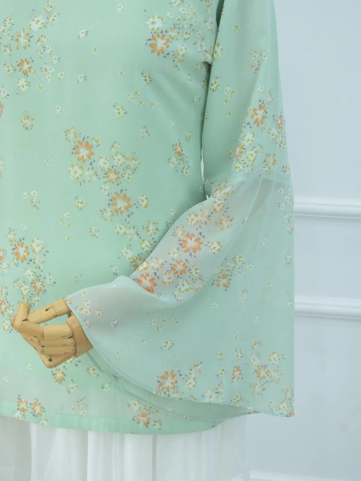Side view of Fiora pastel green kurti, bell sleeves