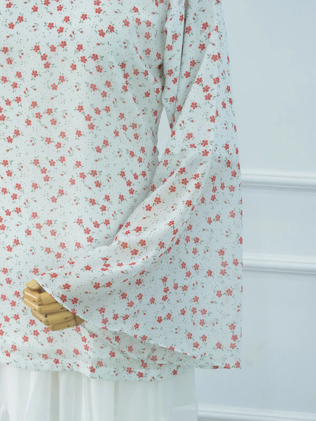 Close-up of sheer bell sleeve, white floral chiffon kurti
