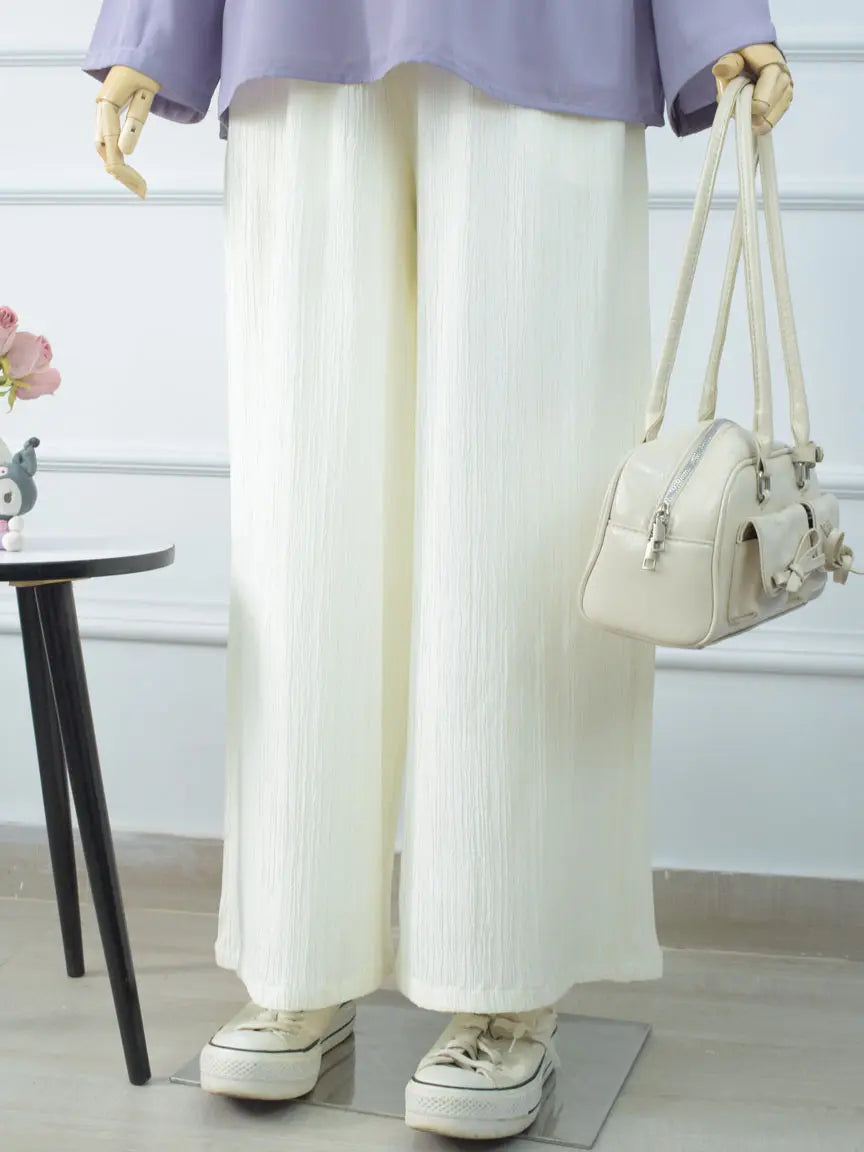 DOVE off-white wide-leg pants styled for a casual everyday look