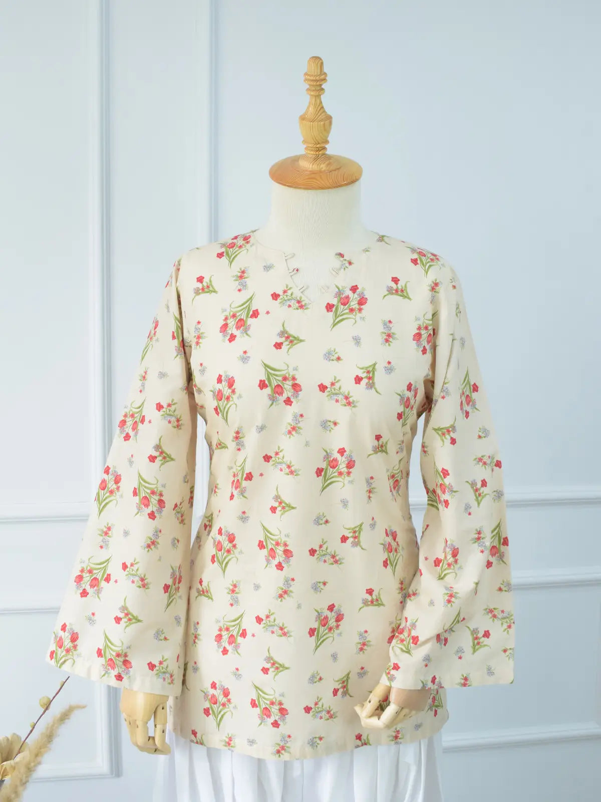 Left side view of Rosie Bloom kurti – wide bell sleeves with scattered red and blue floral print on beige lawn cotton