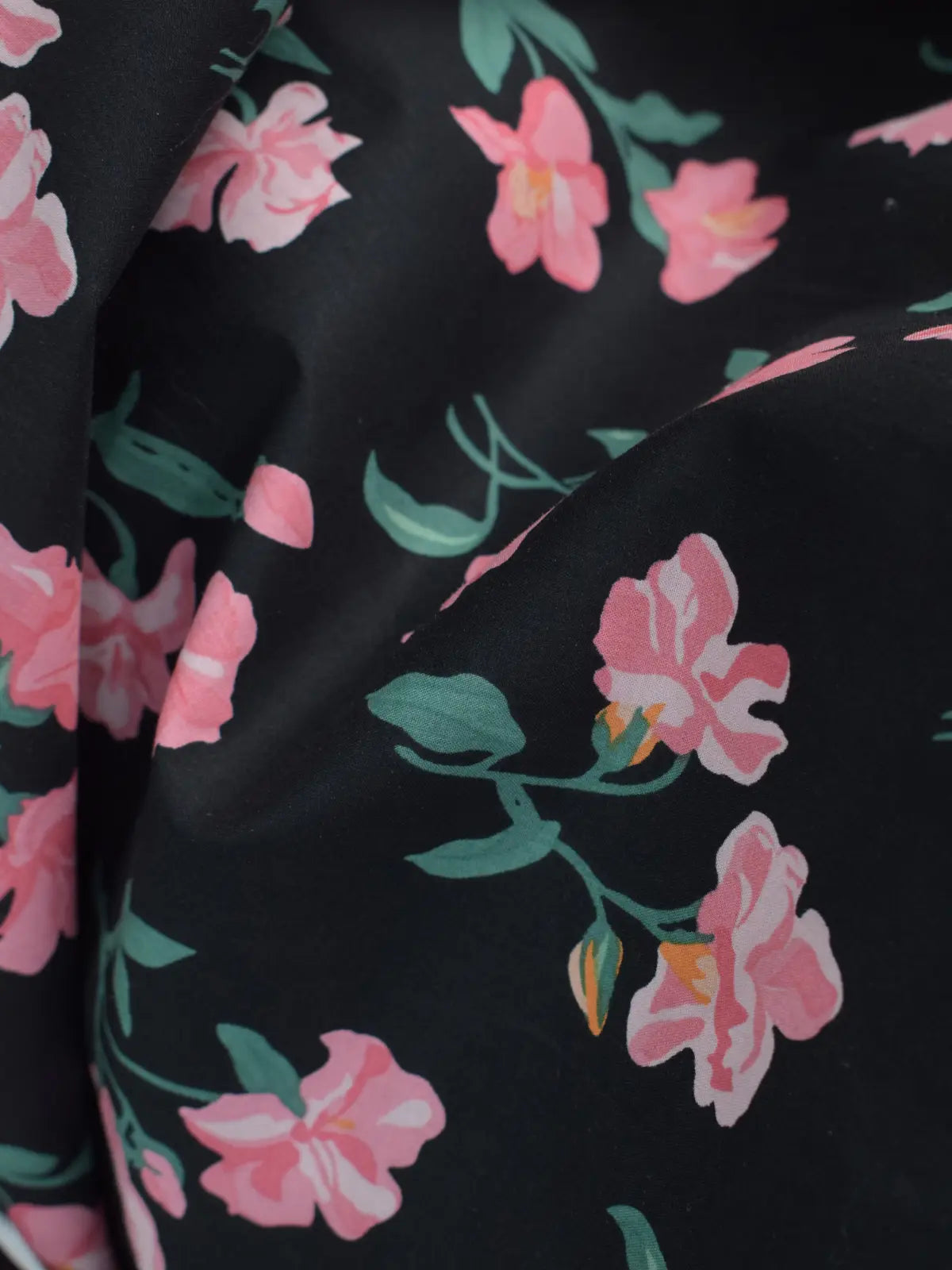 V-neckline detail close-up of Black Petal black kurti – delicate pink floral stems and blooms on black lawn cotton fabric