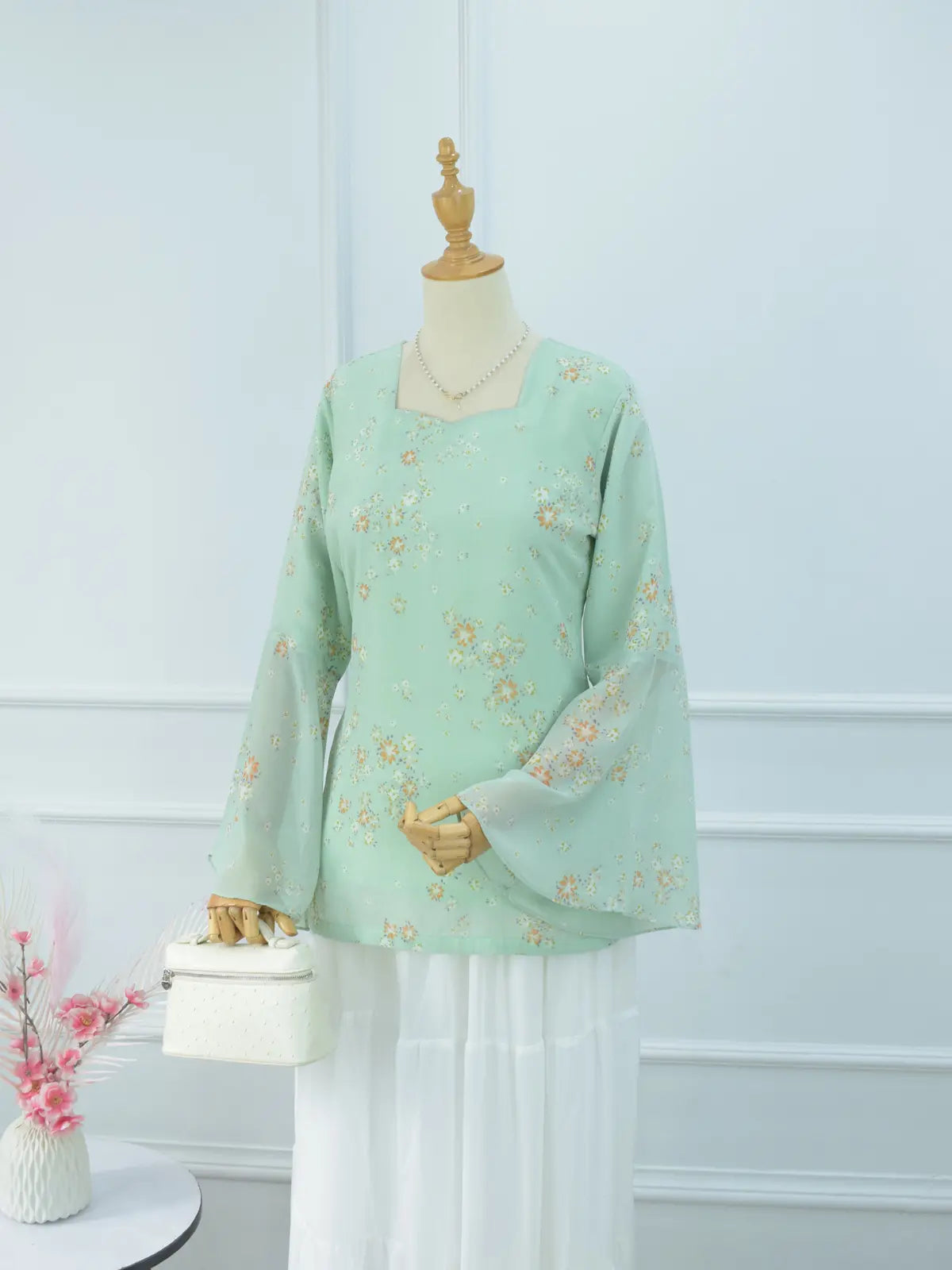Fiora pastel green floral fairy kurti, front view on mannequin