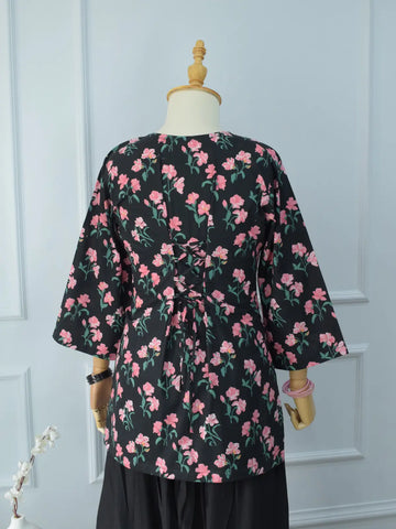 Black Petal lawn cotton fabric close-up – vibrant pink floral and green leaf print on deep black base, soft and opaque texture