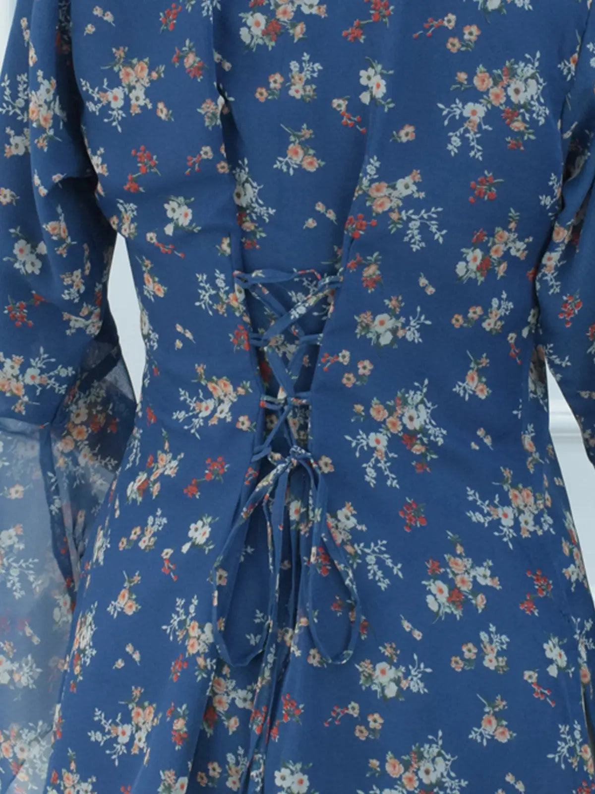 Close-up of corset lace-up back on blue floral kurti