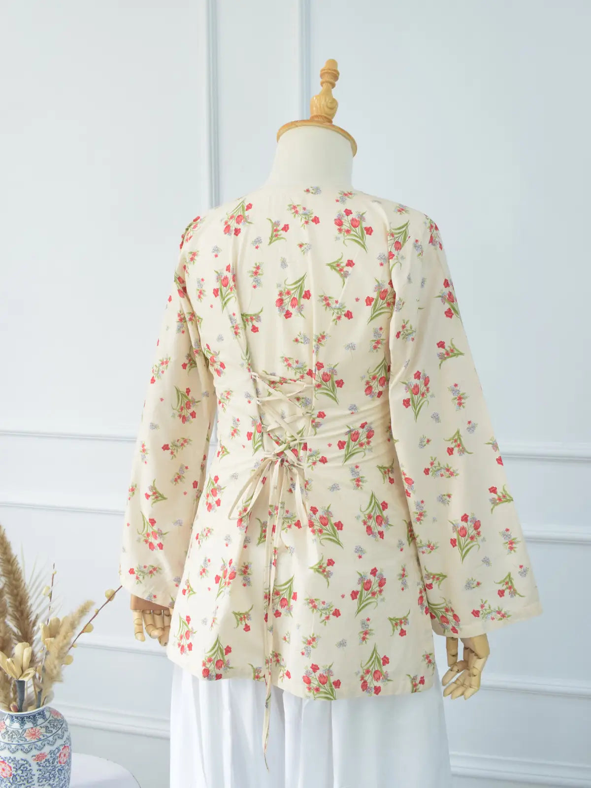 Rosie Bloom lawn cotton fabric close-up – delicate red, pink and blue floral print on soft ivory base, lightweight texture