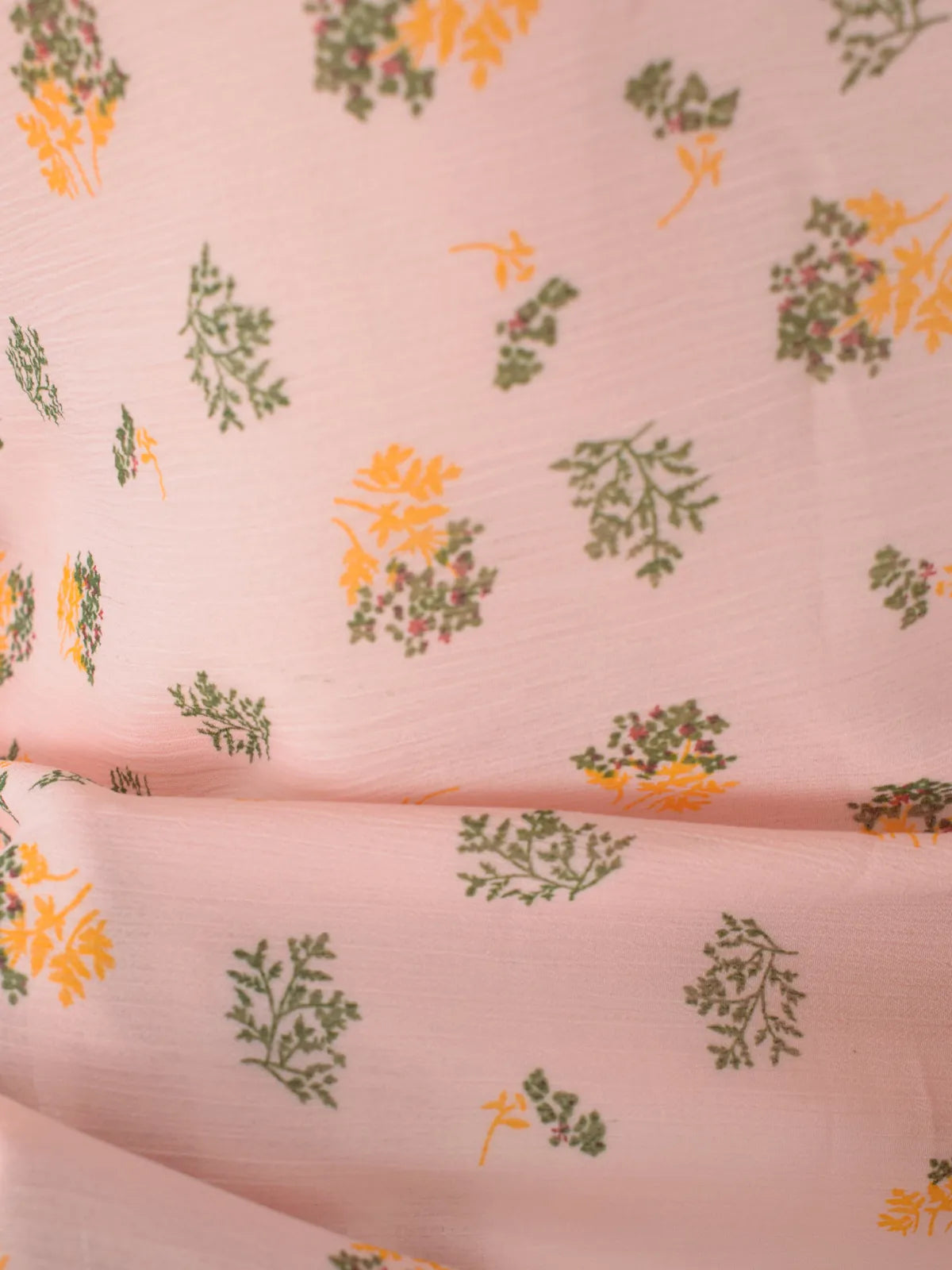 Close-up of light pink chiffon fabric with orange and green ditsyf loral print_ROBES Azelia kurti