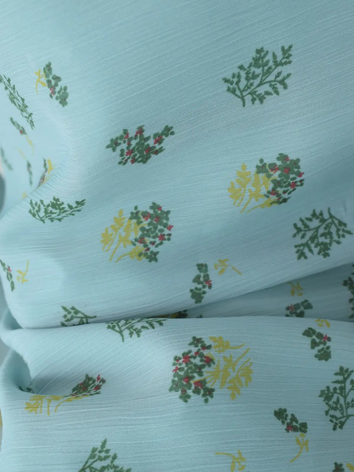 Close-up of pastel blue chiffon fabric with green and yellow ditsy floral print_ROBES Cerelia kurti