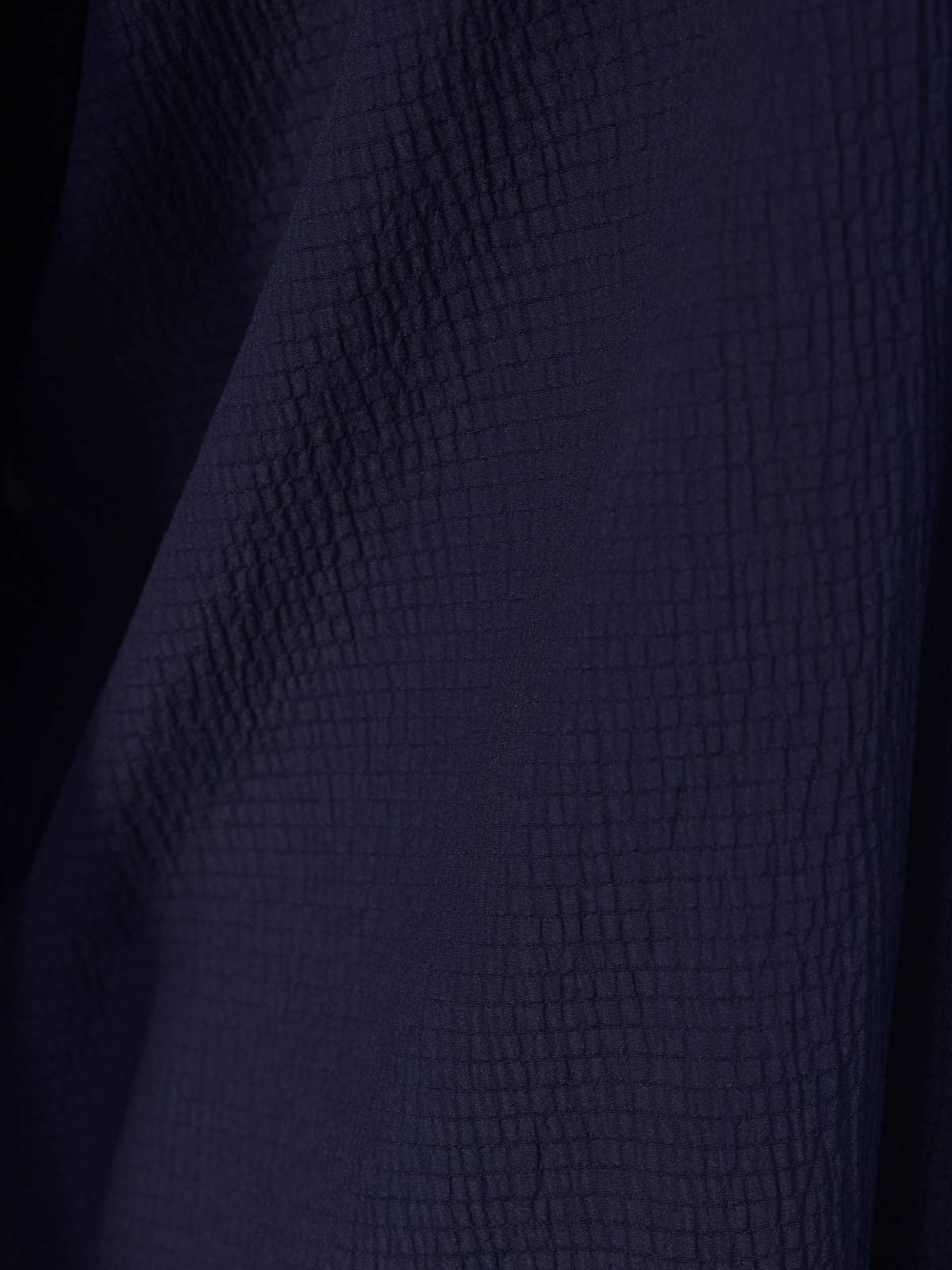 Closeup of textured fabric on Blair navy blue oversized shirt