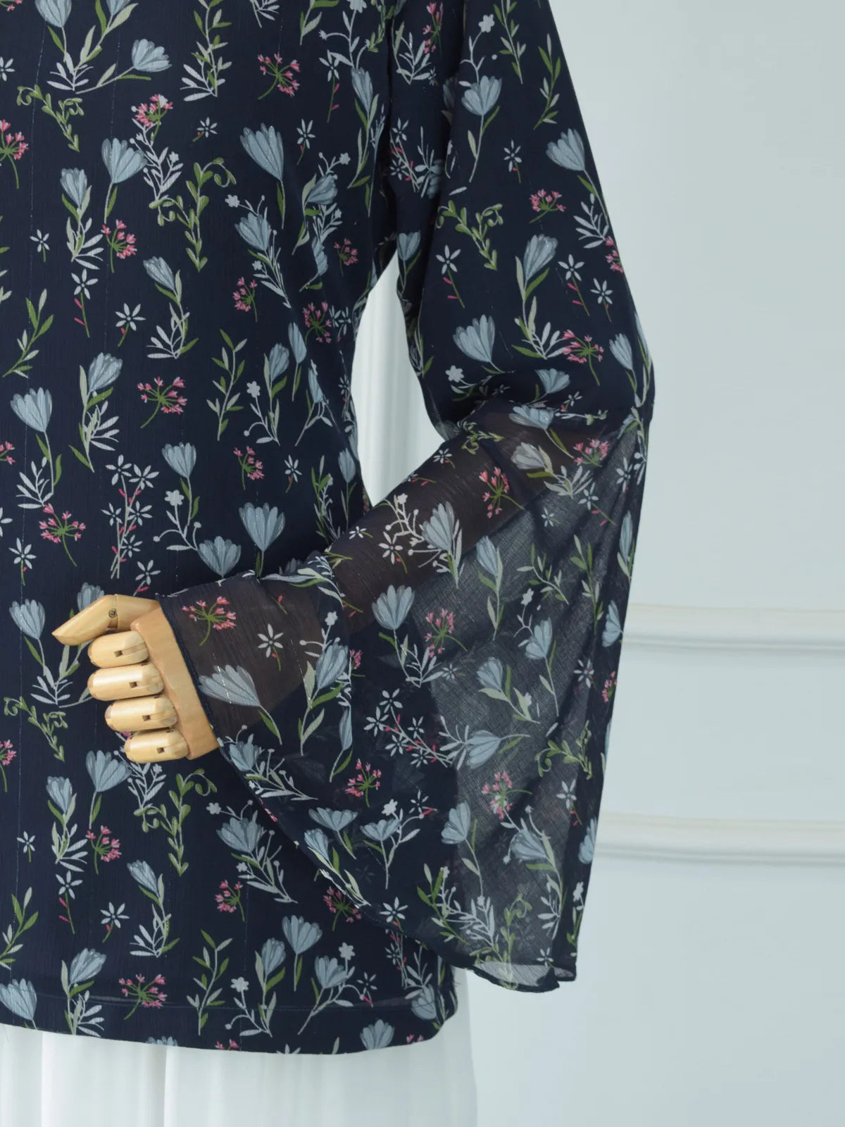 Evalisse navy blue chiffon floral kurti flat lay — square neckline and bell sleeves visible