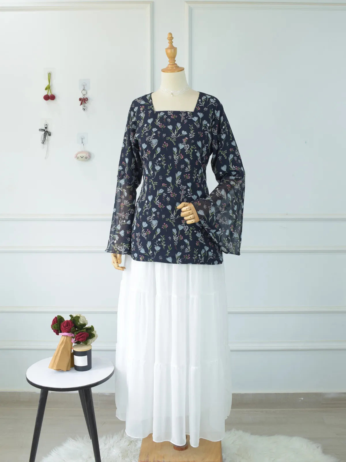 Evalisse navy blue floral kurti — back view showing corset lace-up detail and bell sleeves
