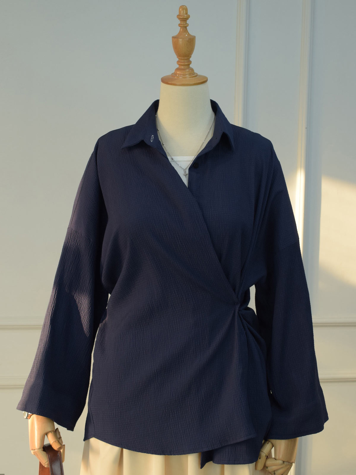 Lifestyle shot of Blair navy blue textured oversized button down shirt