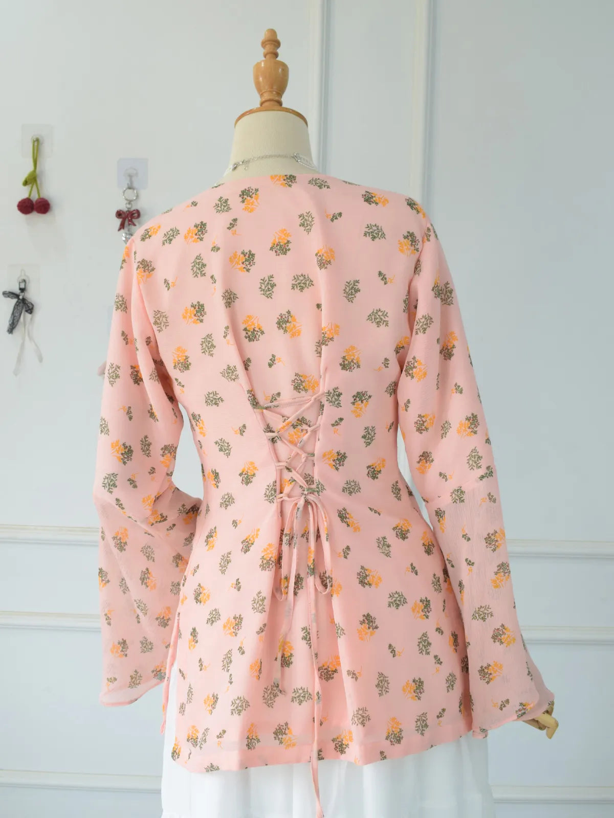 ROBES Azelia pink fairy kurti_back view showing corset lace-up detail and flared bell sleeves