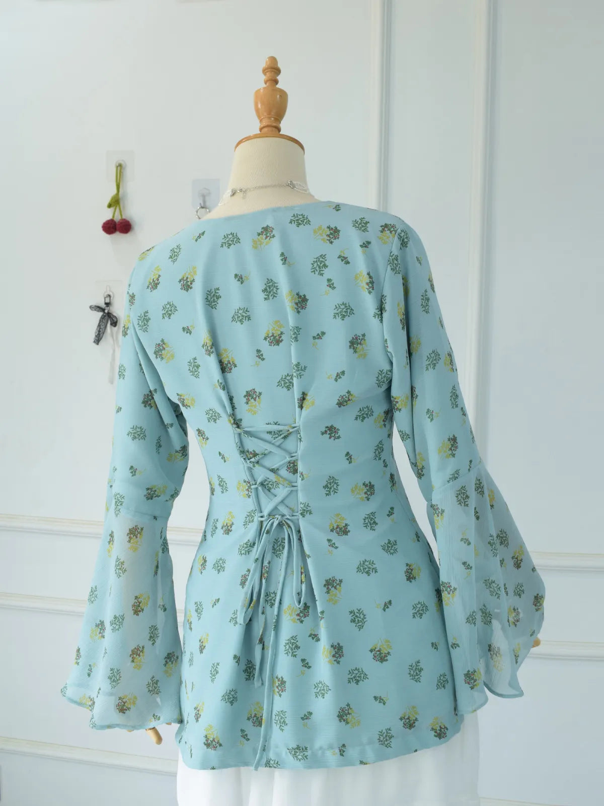 ROBES Cerelia pastel blue fairy kurti_back view showing corset lace-updetail and flared bell sleeves