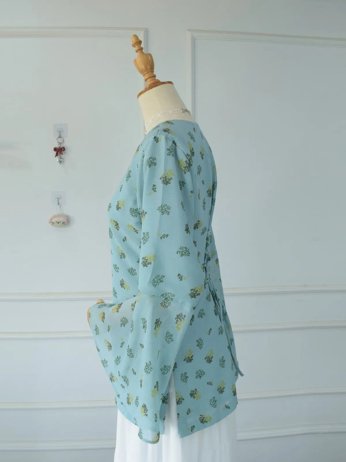 ROBES Cerelia pastel blue floral kurti_side profile view showing fitted waist and bell sleeve silhouette